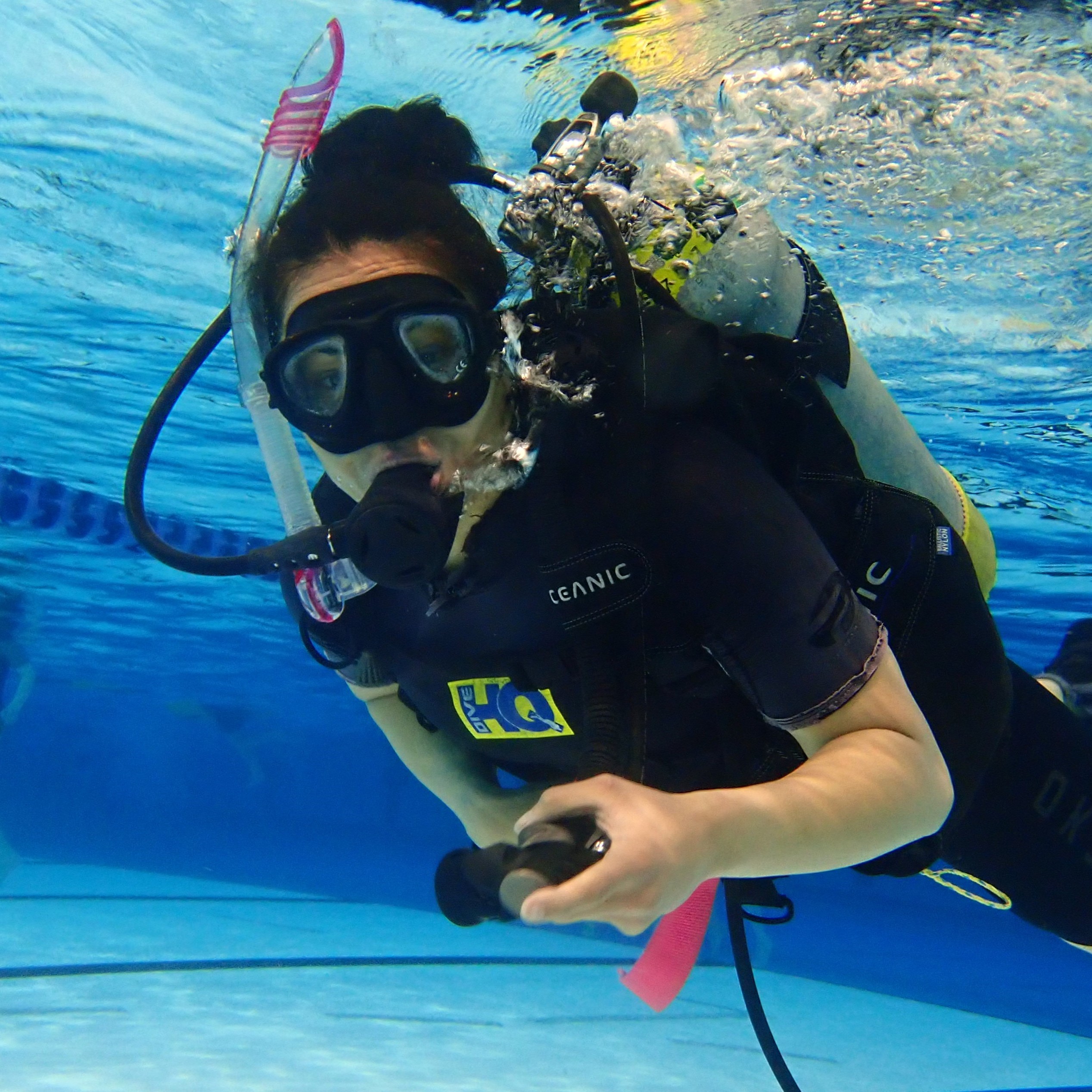 Trying scuba diving in the pool